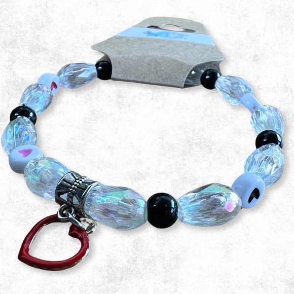 Beaded stretchy bracelet with clear acrylic beads, heart beads and charm - Picture 1 of 3